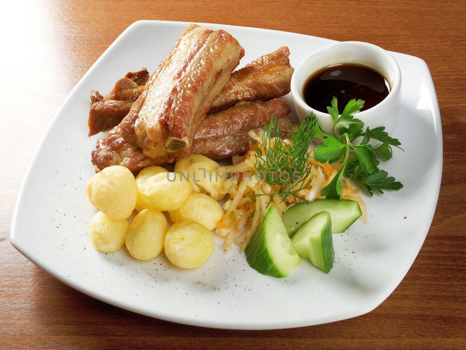 barbecued pork ribs and vegetables