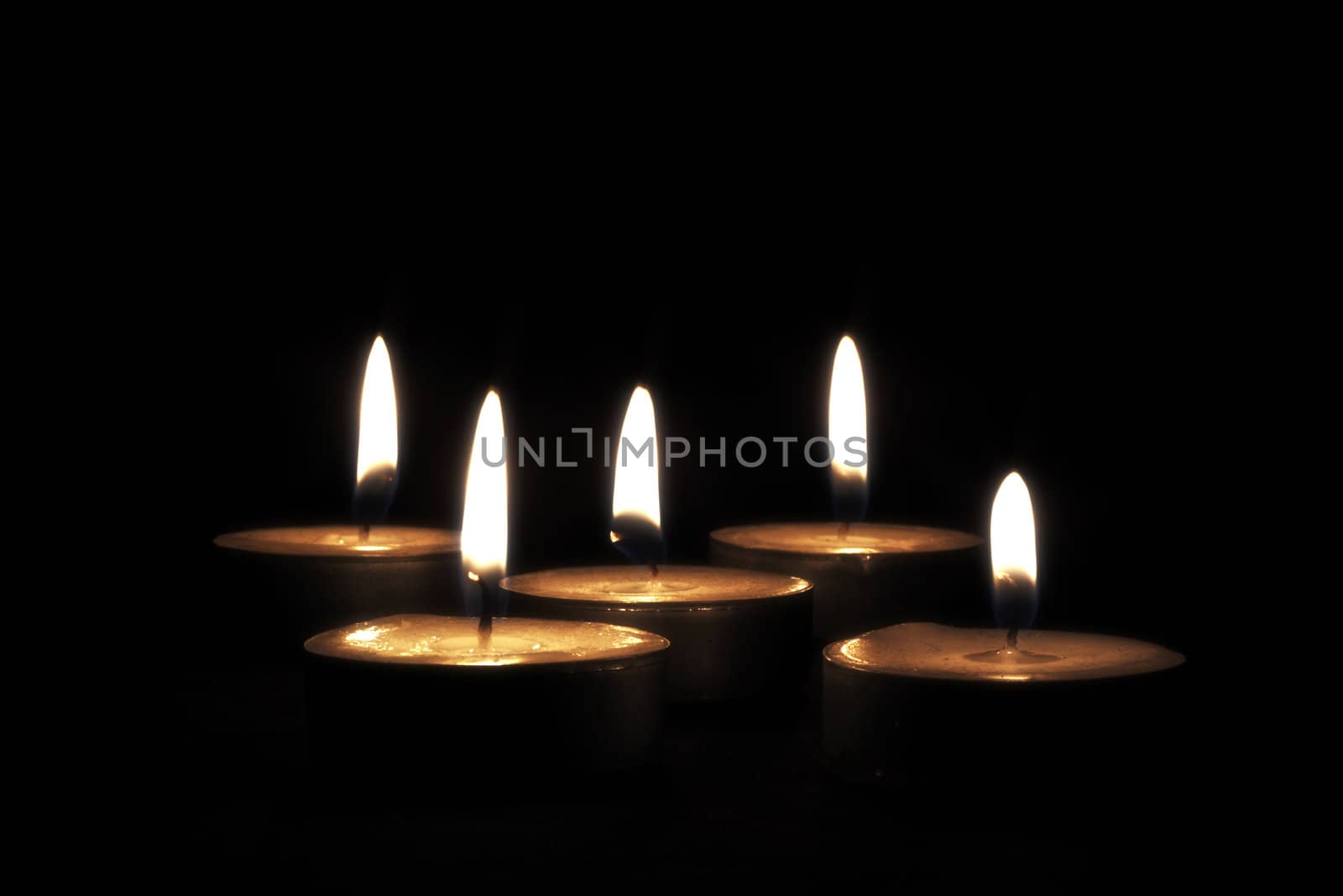 Candles on black background