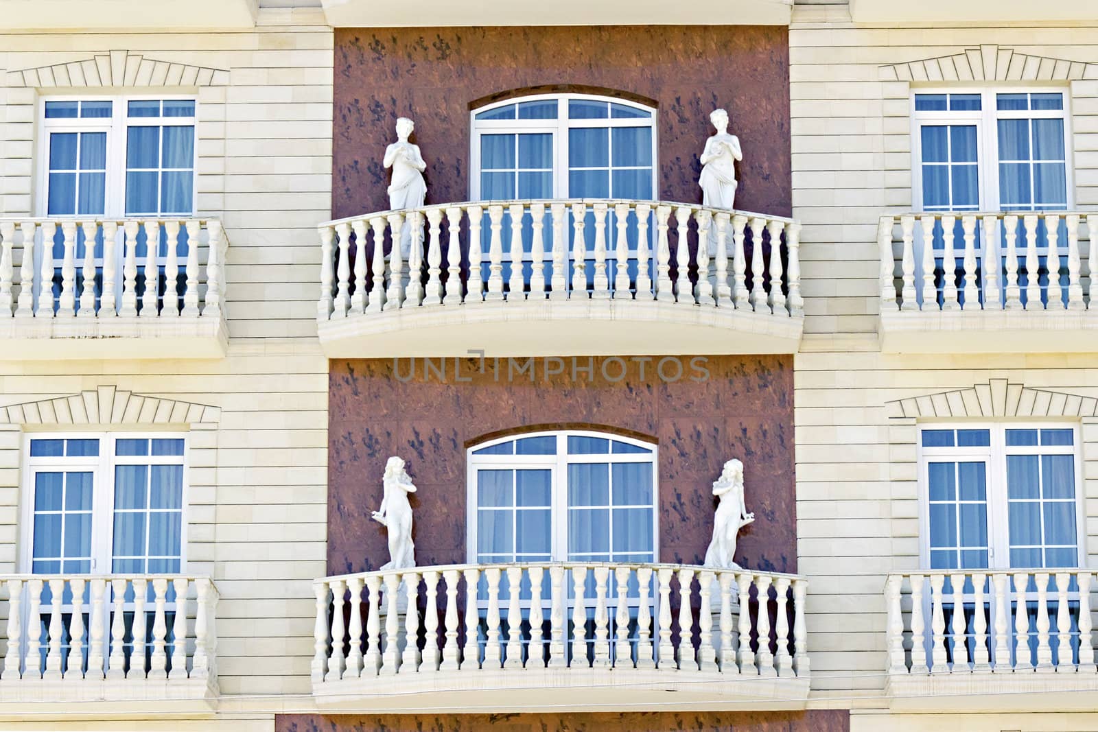 female sculptures on the facade of the building