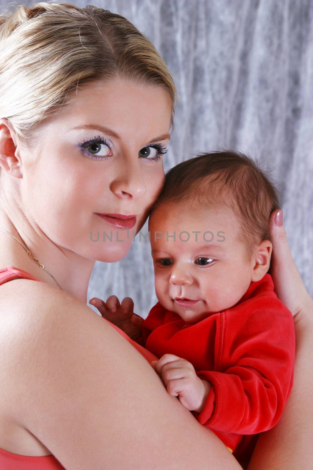 Mother with her newborn baby in home