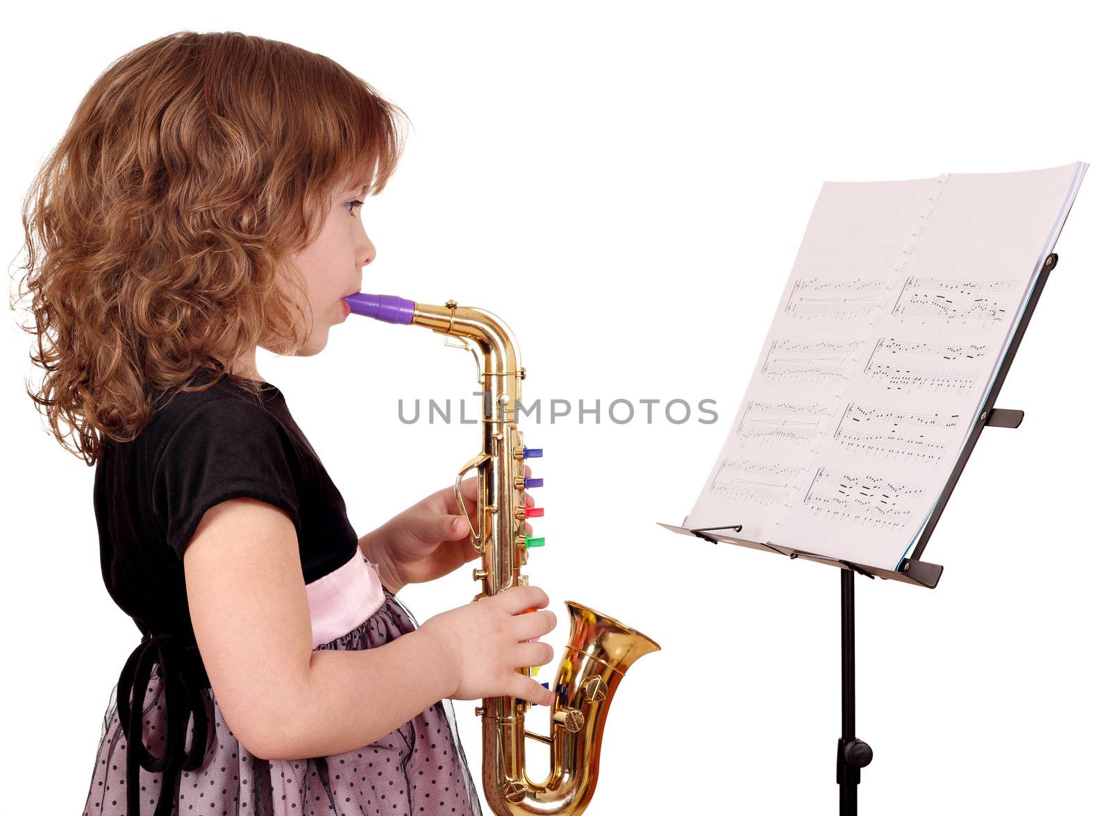 little girl play music on saxophone