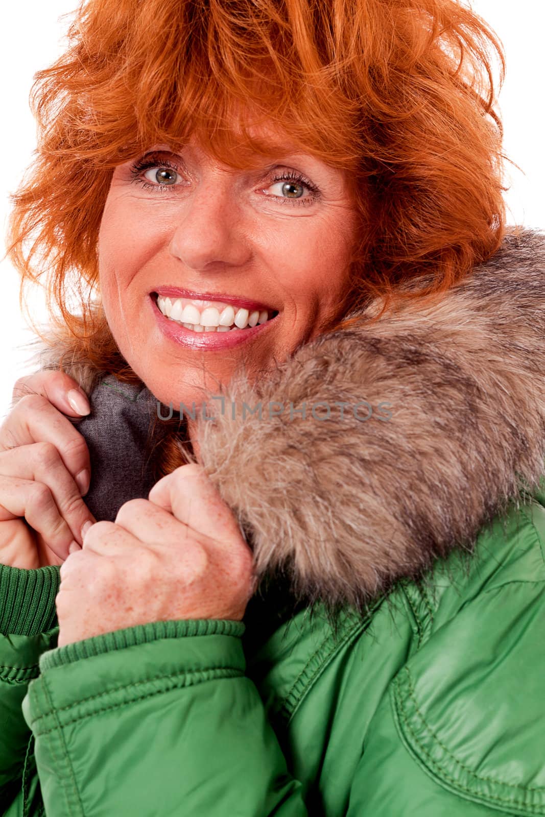 adult redhead woman with winter jacket smiling isolated on white background