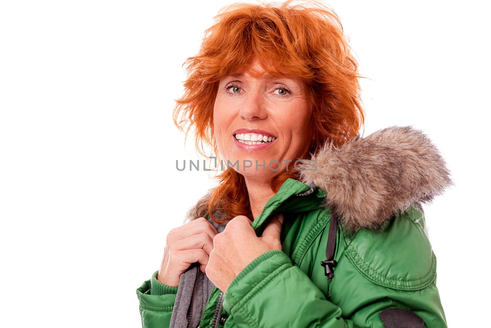 adult redhead woman with winter jacket smiling isolated on white background