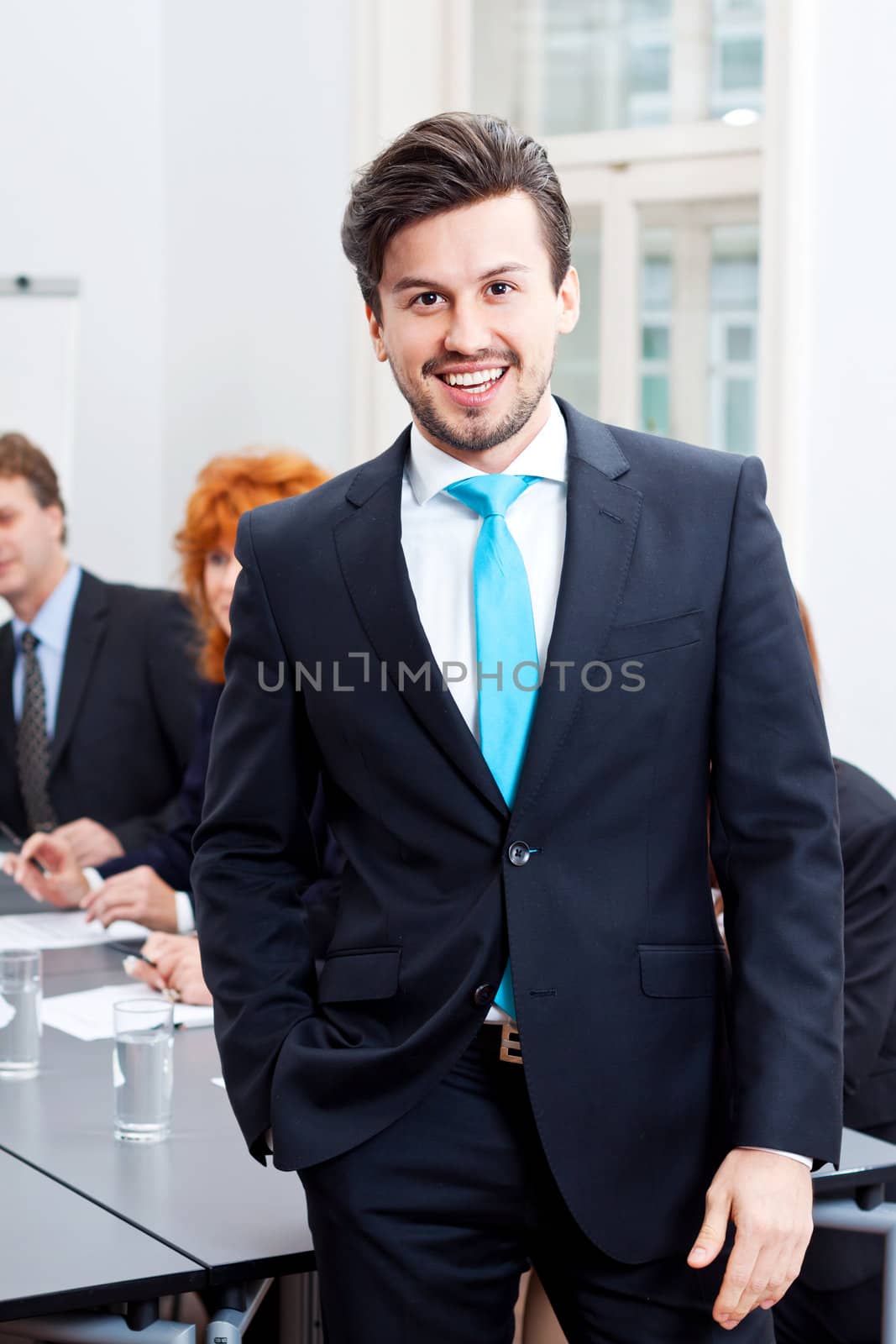 successful business man portrait at office by juniart