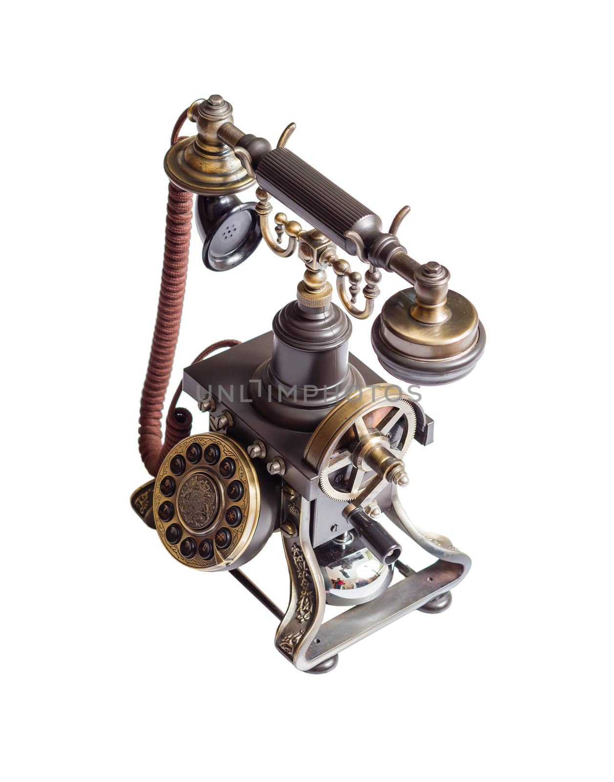 Decorated retro vintage metal telephone isolated on white background
