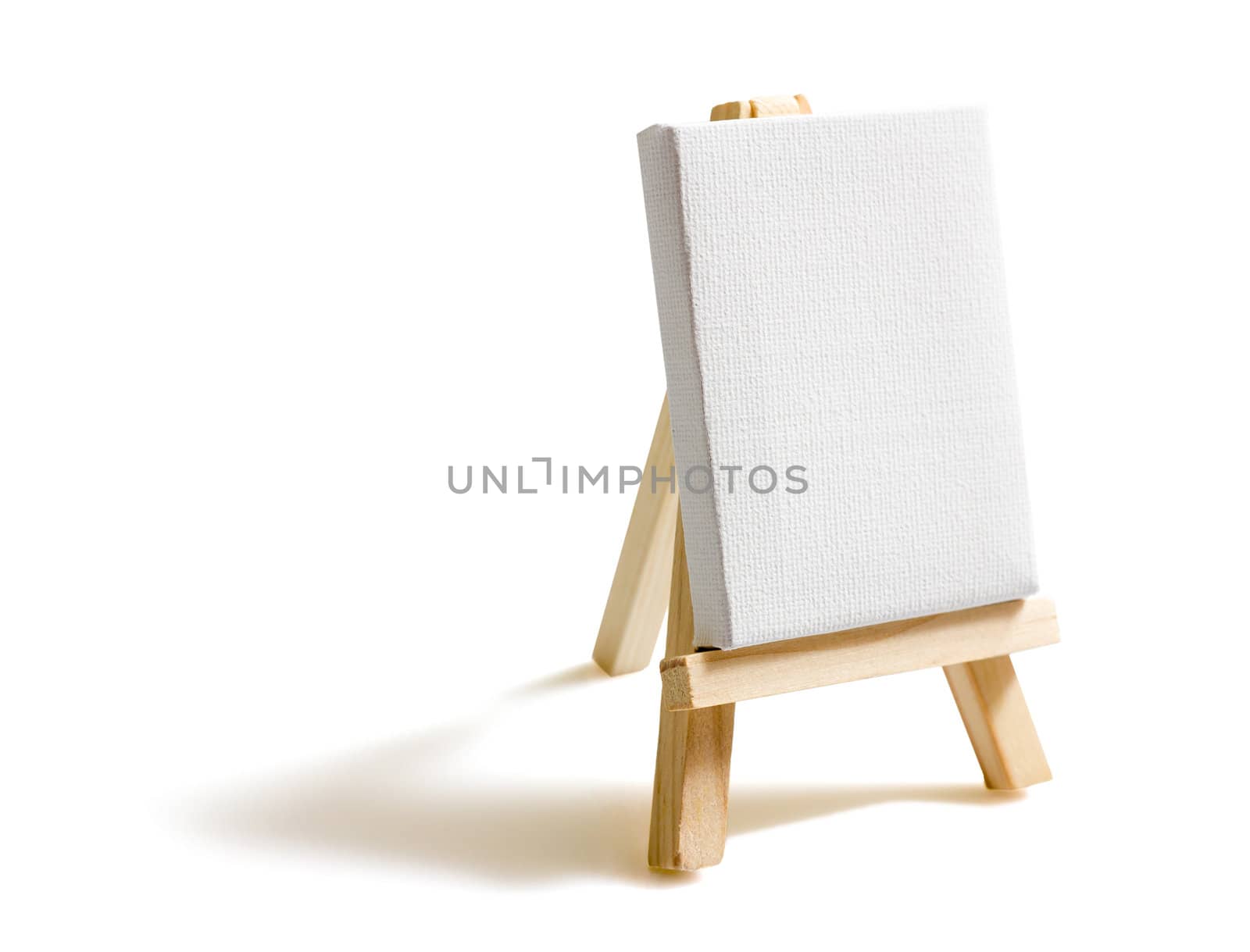 Blank canvas on easel isolated on white background by doble.d