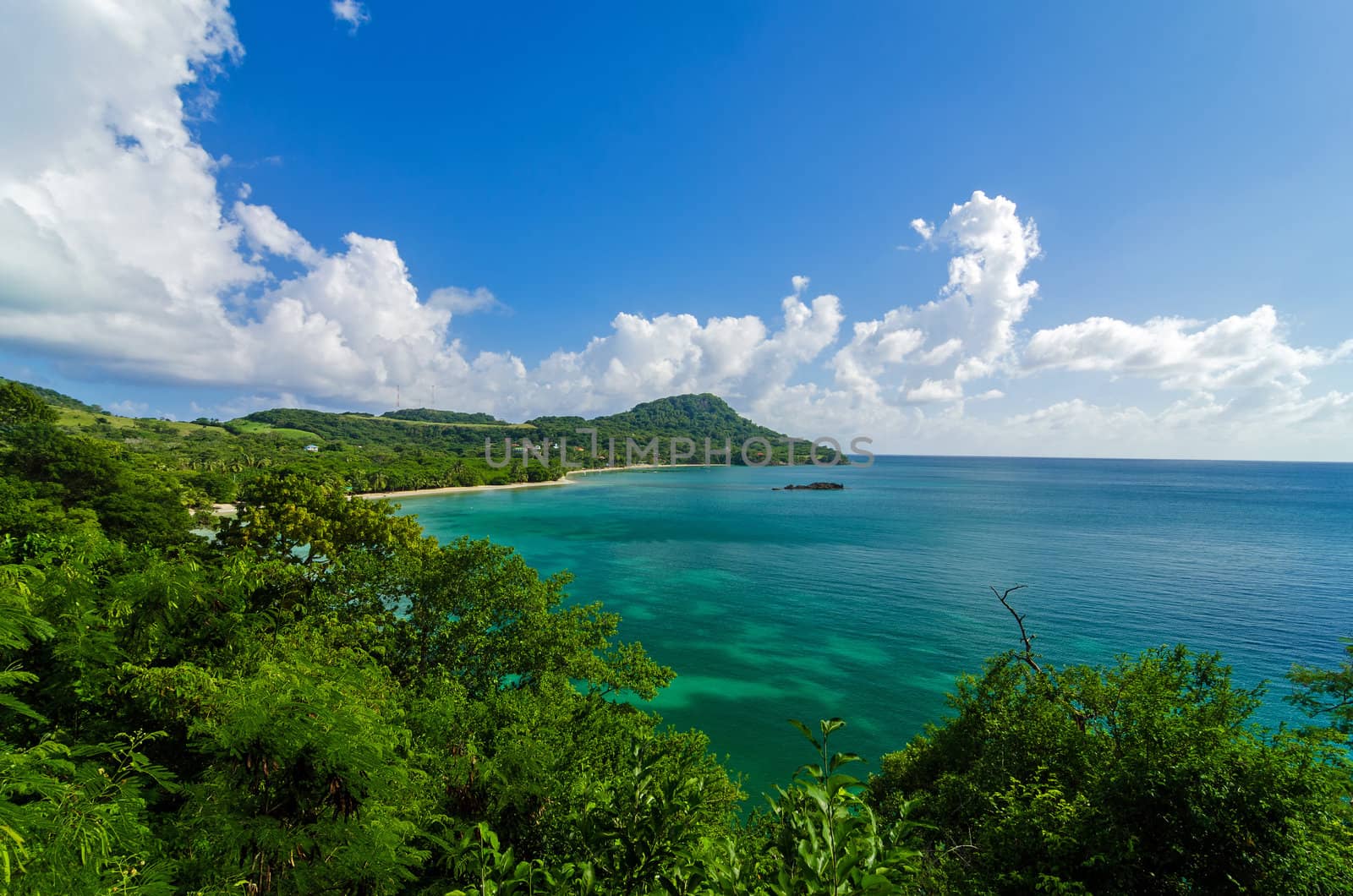 Stunning Caribbean bay on a lush green tropical island