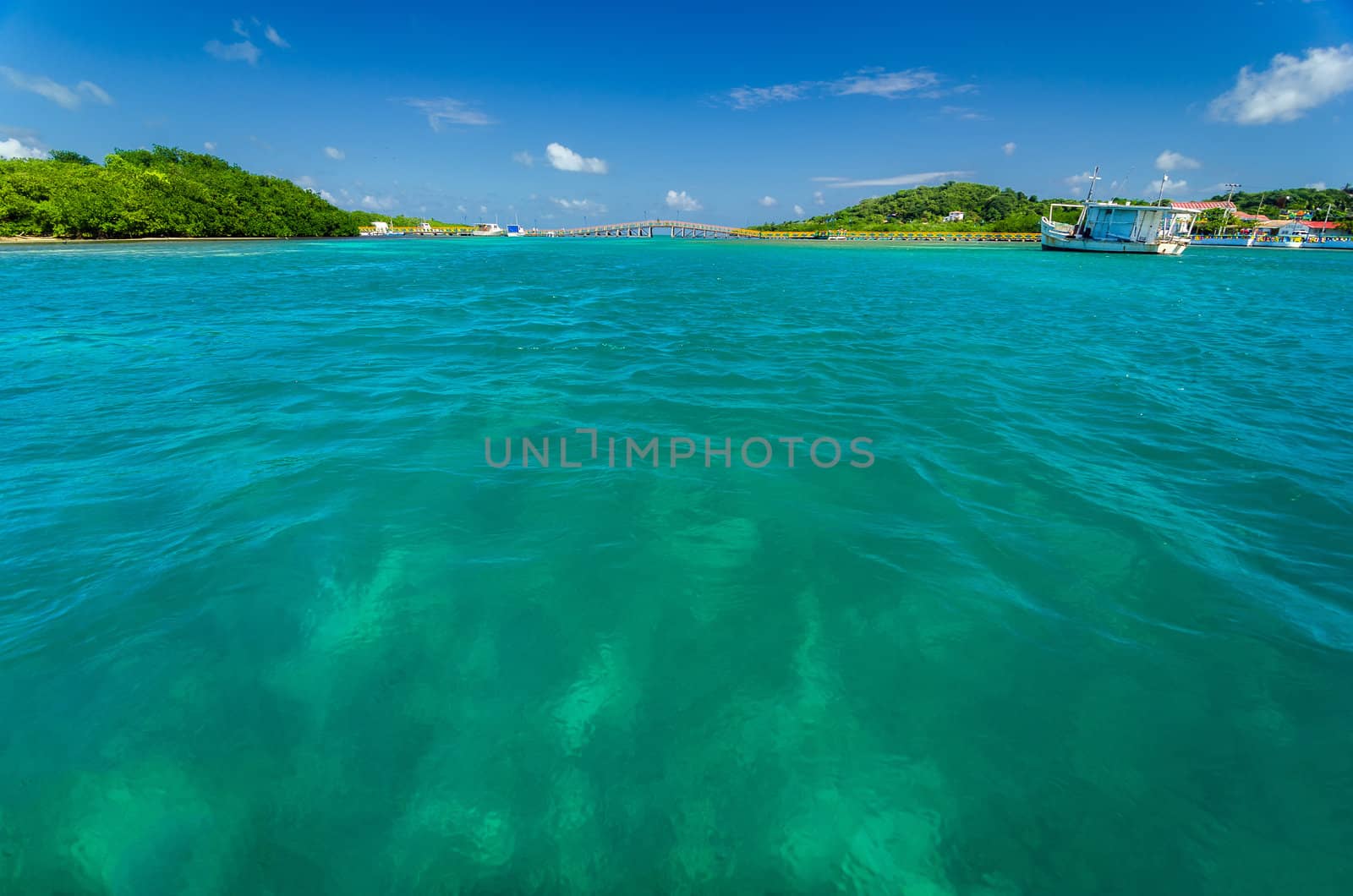 View of beautiful Caribbean water with a far away bridge in San Andres y Providencia, Colombia