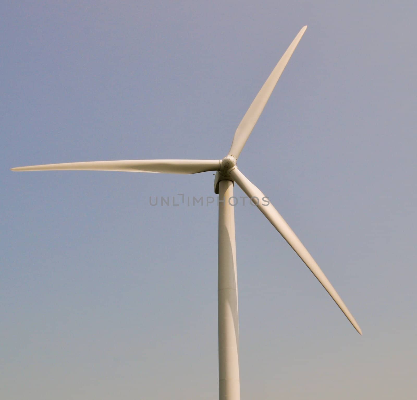 Wind turbine in blue sky