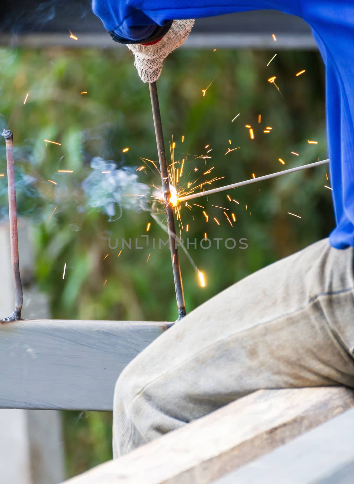 Welder welding  elements at the  construction site