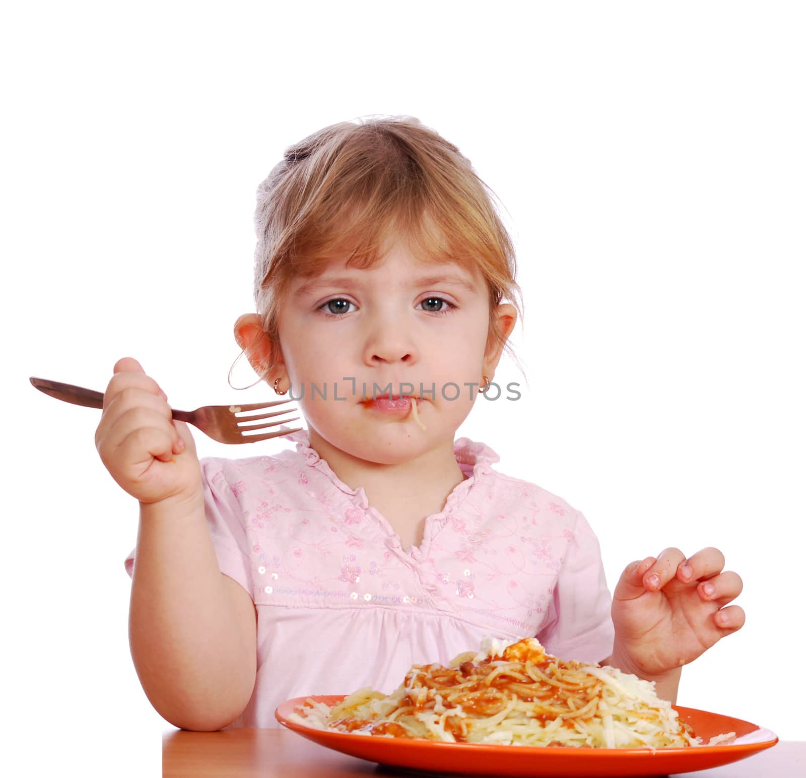 Little girl with spaghetti studio shot