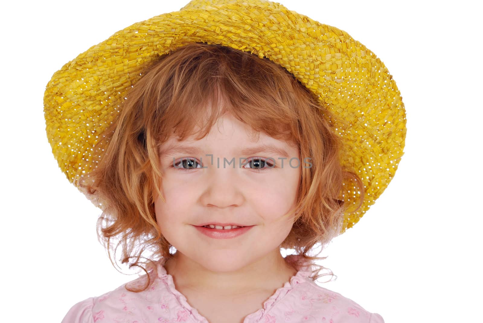Little girl with yellow straw hat studio shot