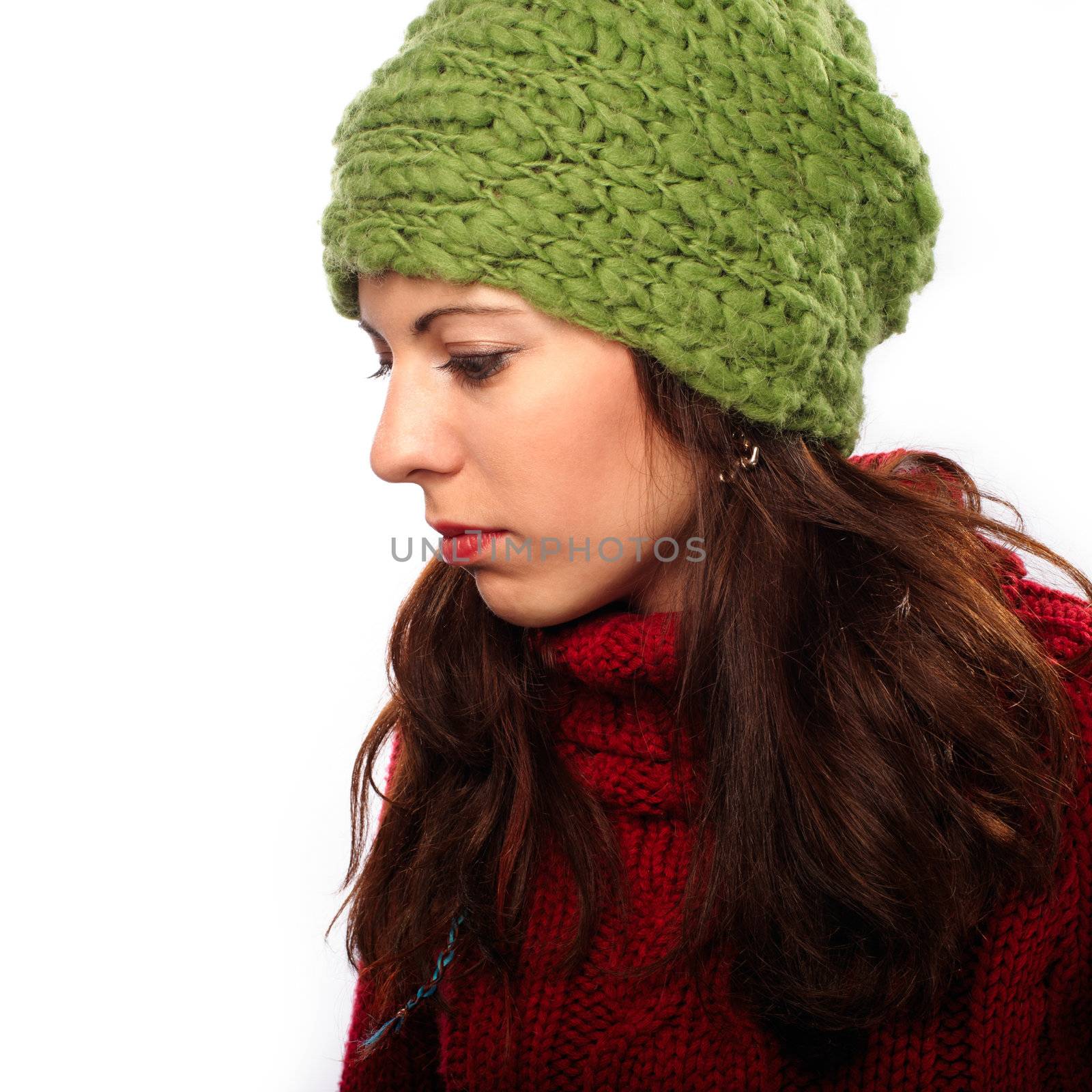 Attractive young caucasian woman in red sweater on white background