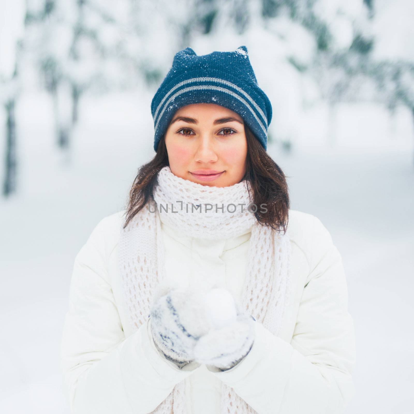 Portrait of beautiful young girl in winter day