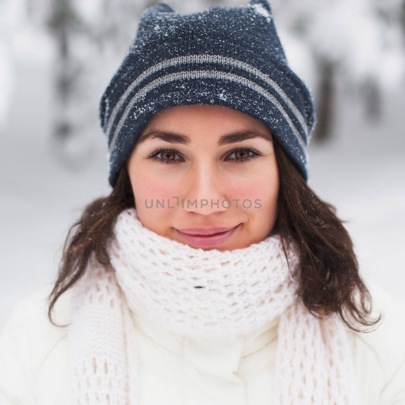Portrait of beautiful young girl in winter day