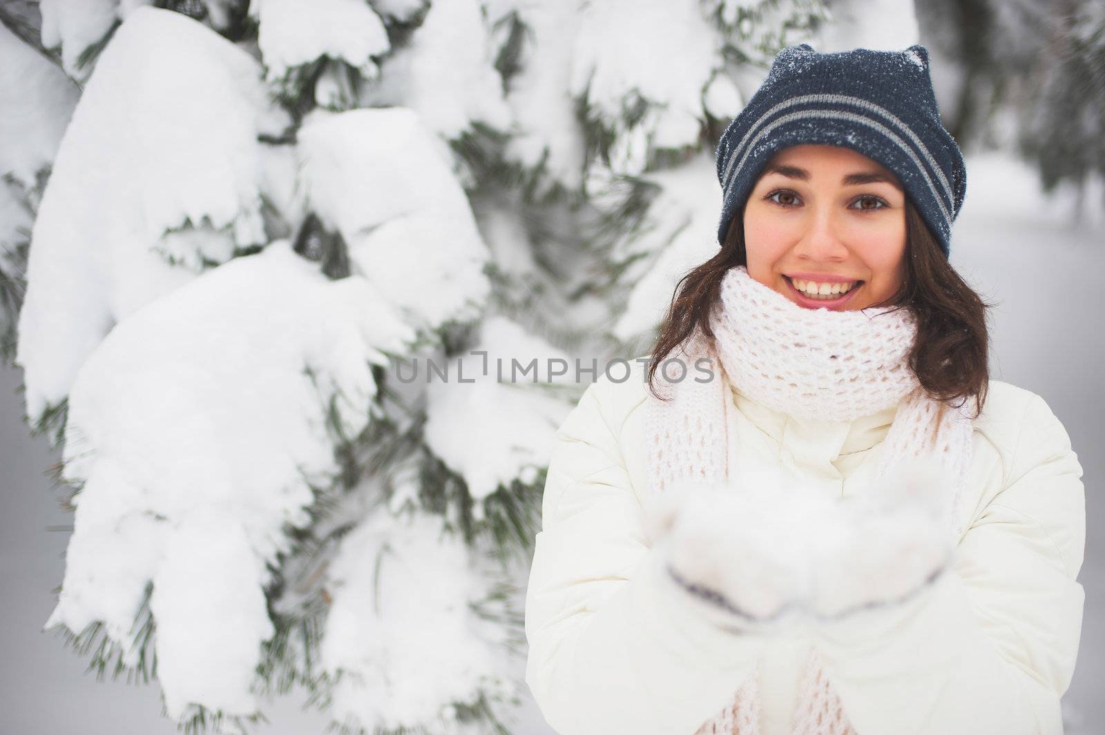 Portrait of beautiful young girl in winter day