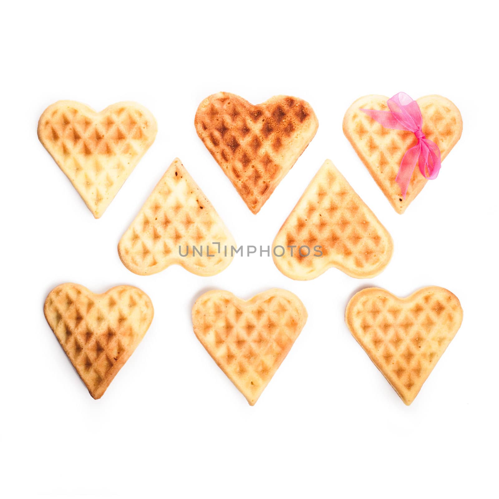 Heart shaped waffles isolated on white background