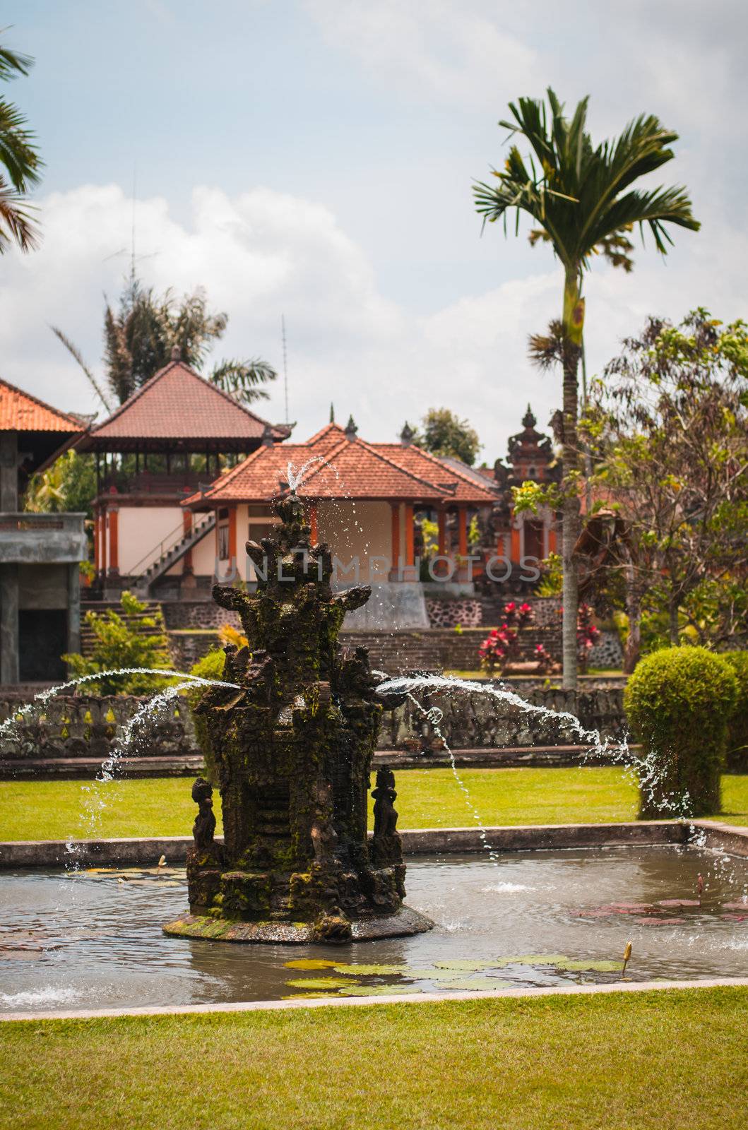 Fountain near main gate to Pura Taman Ayun by nvelichko