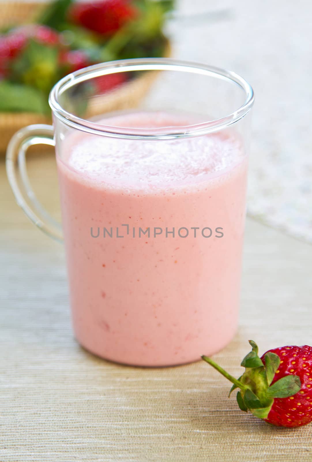 Strawberry smoothie with yogurt by fresh strawberries