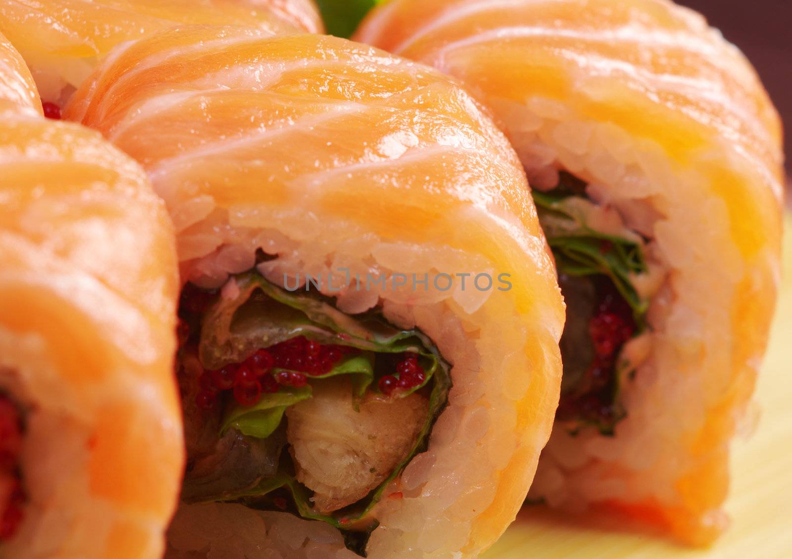 Uramaki. Philadelphia classic. Salmon, Philadelphia cheese, cucumber, avocado, tobiko. Japanese sushi