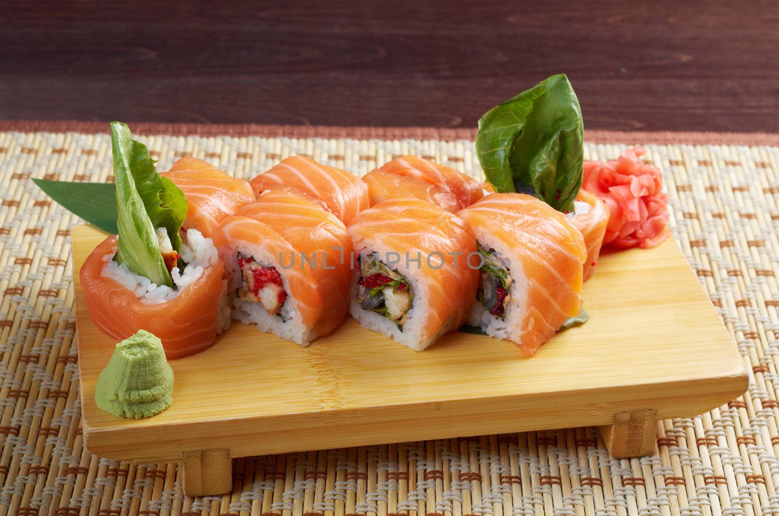 Uramaki. Philadelphia classic. Salmon, Philadelphia cheese, cucumber, avocado, tobiko. Japanese sushi