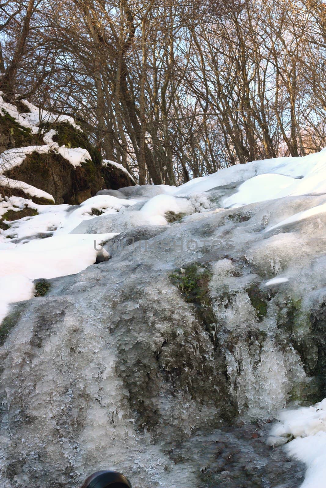 frozen waterfall in a cold winter day