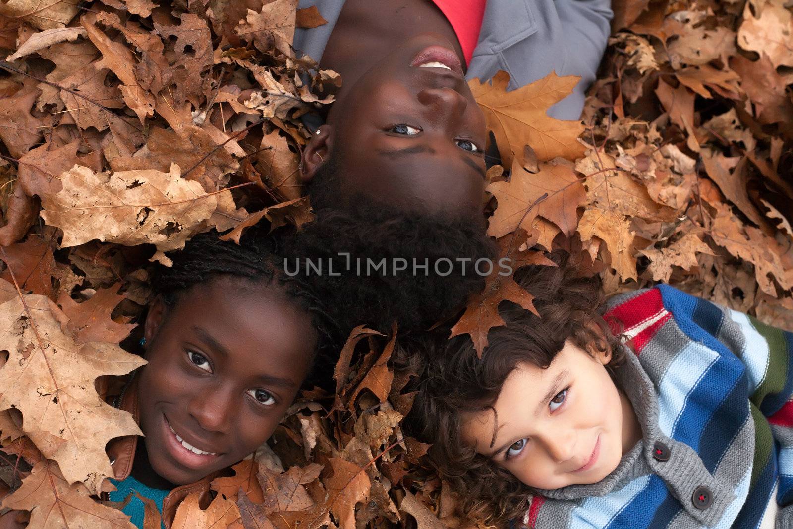 Happy family with foster children in the forest