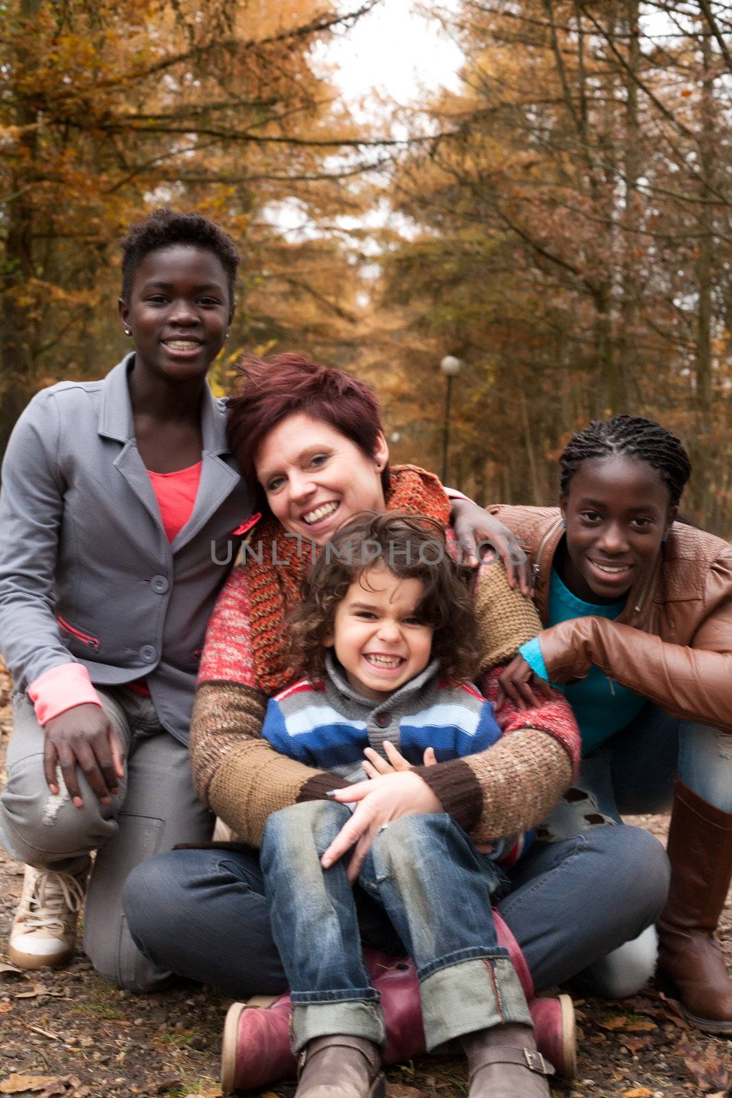 Multiracial family in the autumn by DNFStyle