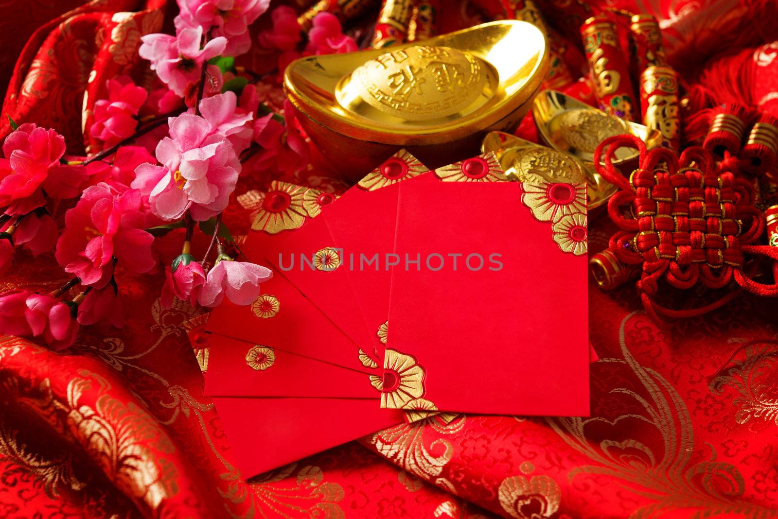 Chinese new year festival decorations , the chinese character on the gold ingots means fortune and luck