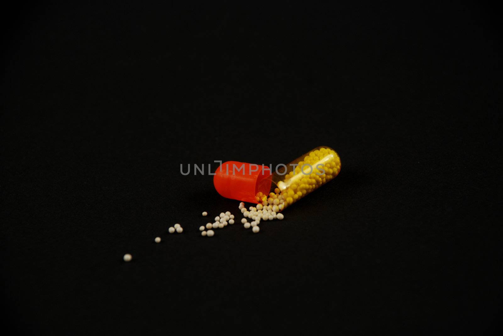 pictures of capsule pills showing the medicine inside it