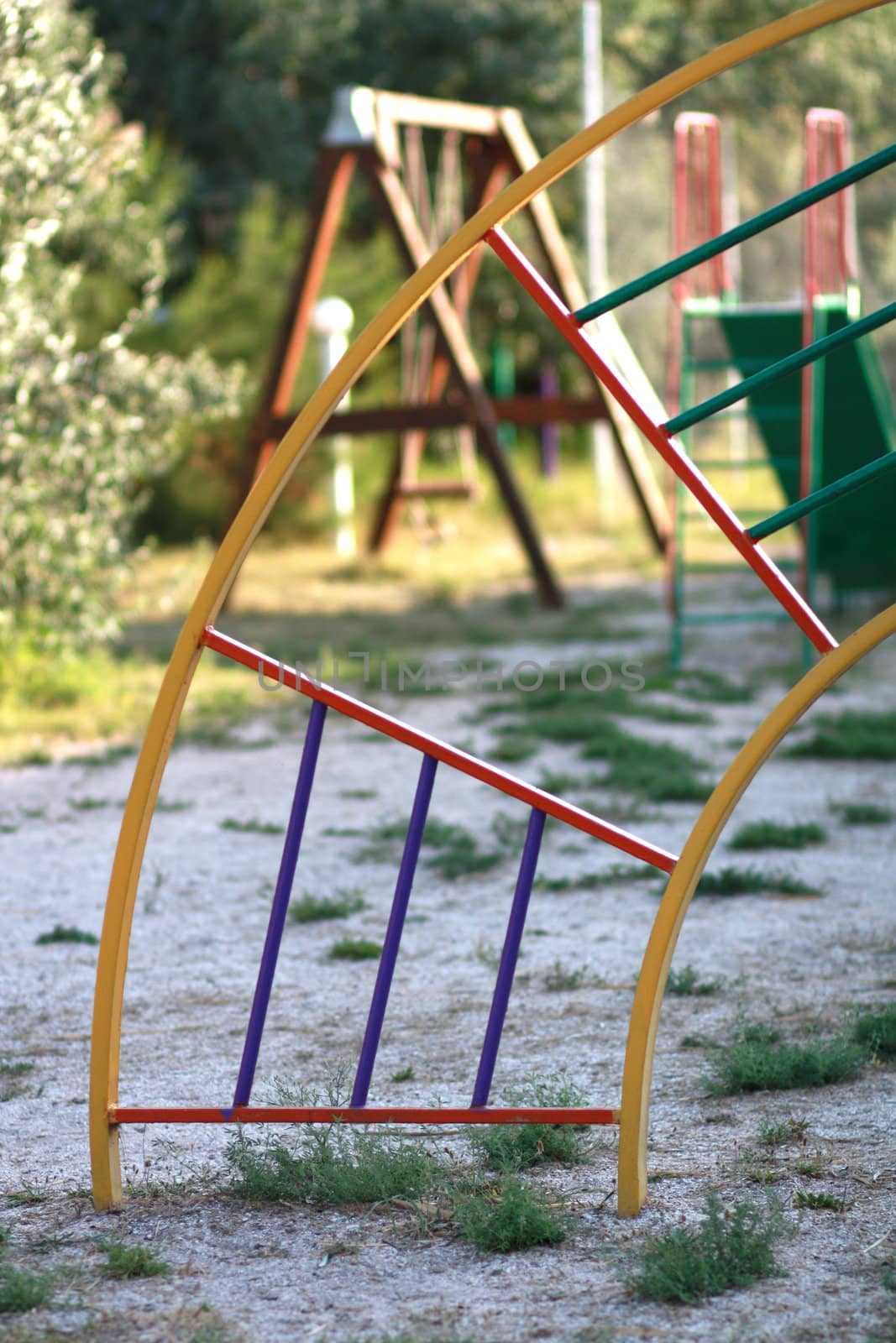 Playground with a circular staircase amid swings and slides