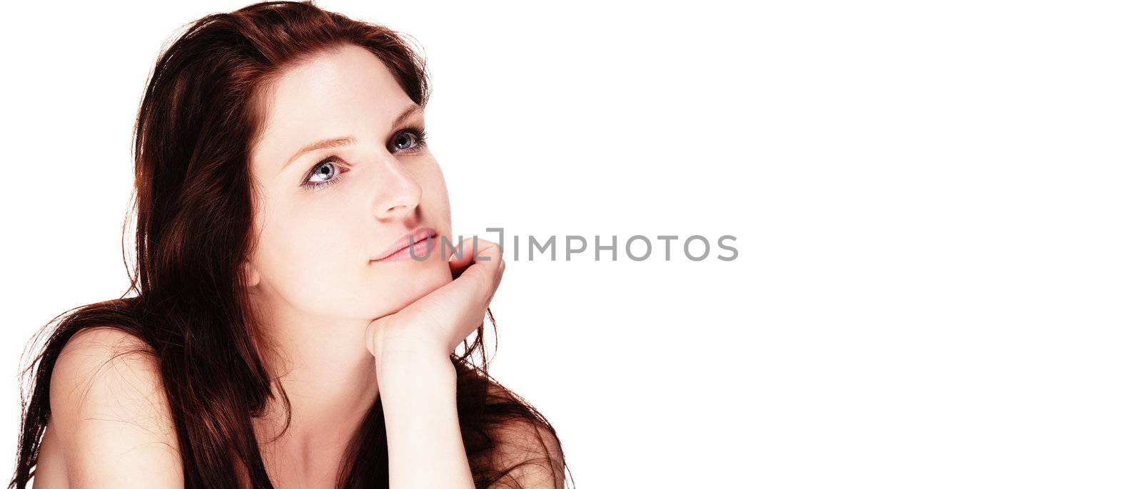 portrait of a beautiful dreaming woman on white background