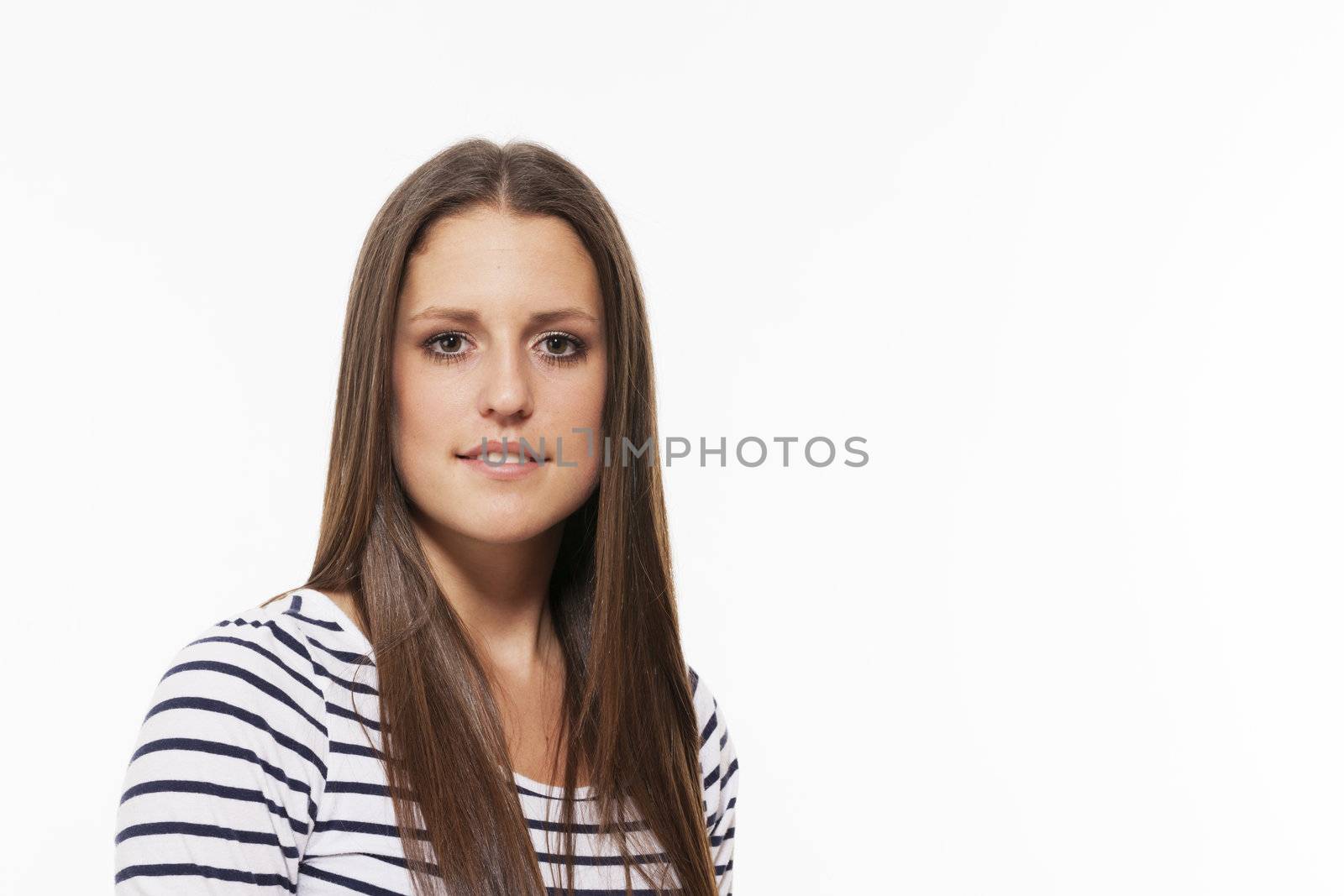 portrait of a pretty brunette teenager on white background