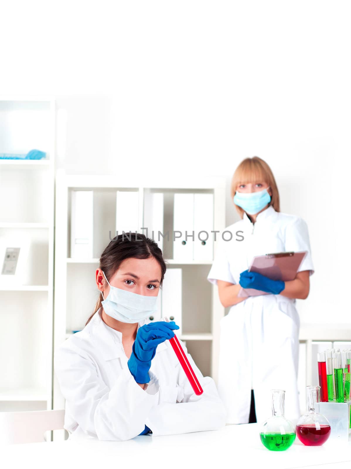 group of scientists working in laboratories with equipment