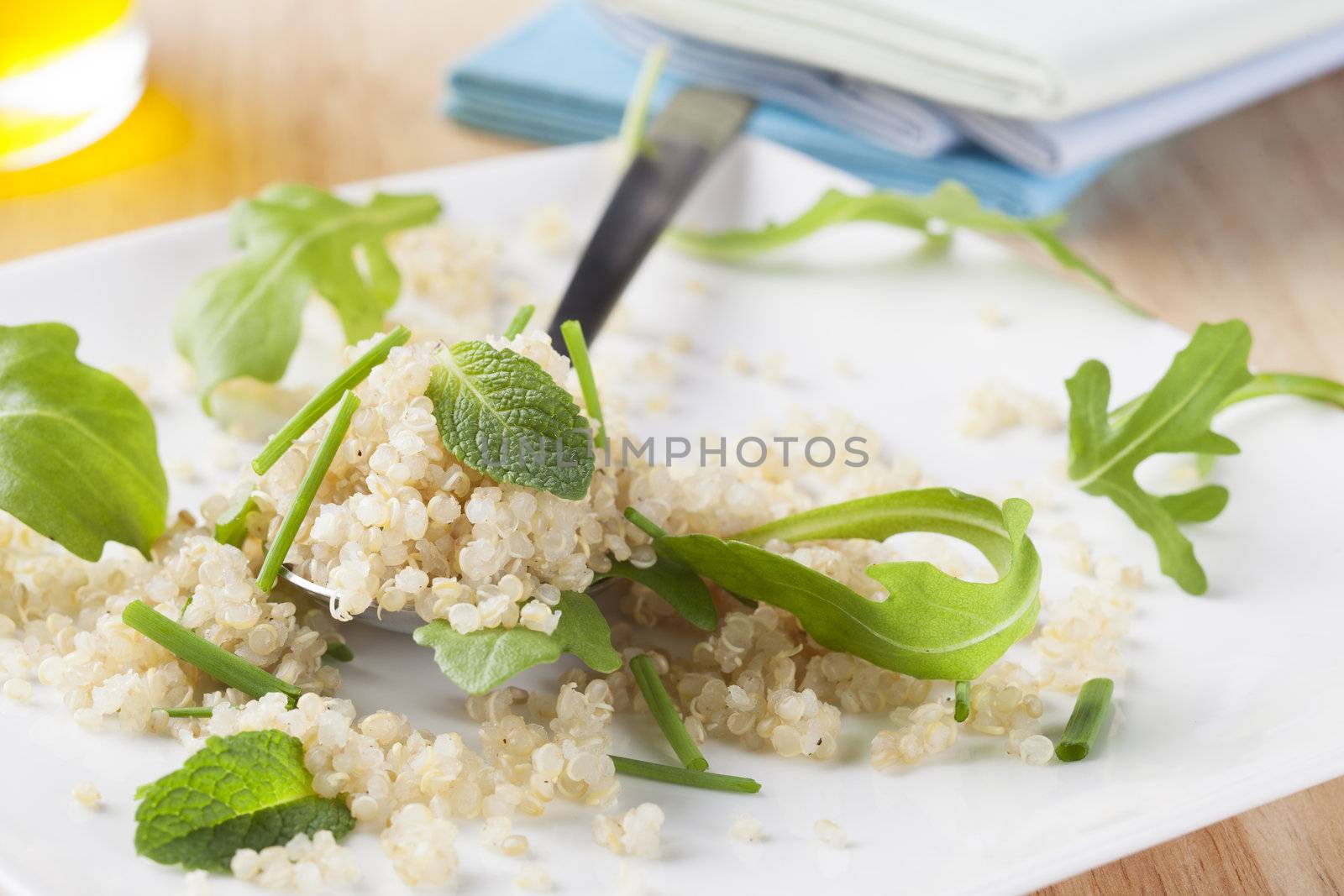 Fresh quinoa salad with herbs and arugula