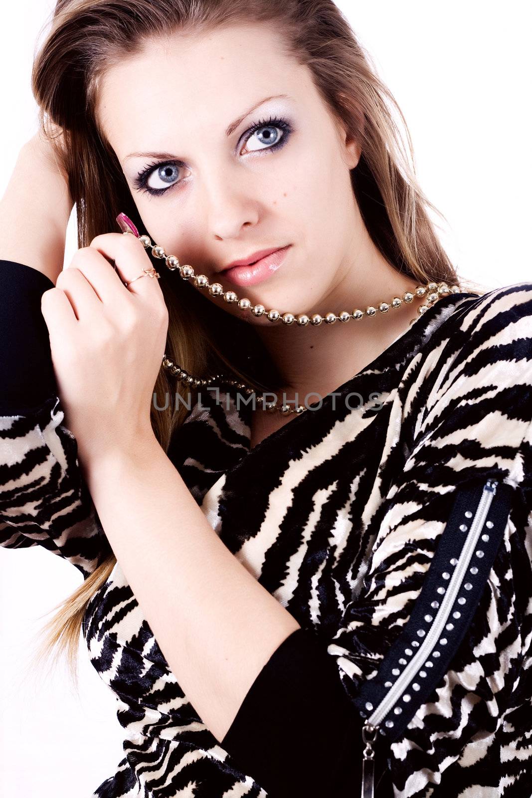 Ambition and greed in fashion woman with jewelry in hands on white background

