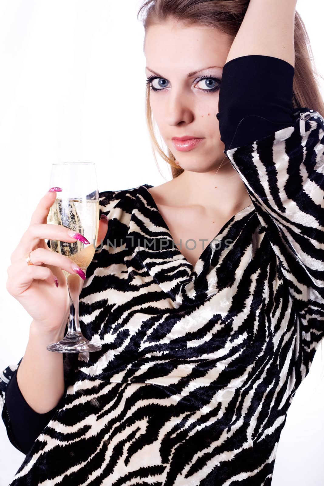 Girl with a glass of champagne isolated on a white background.
