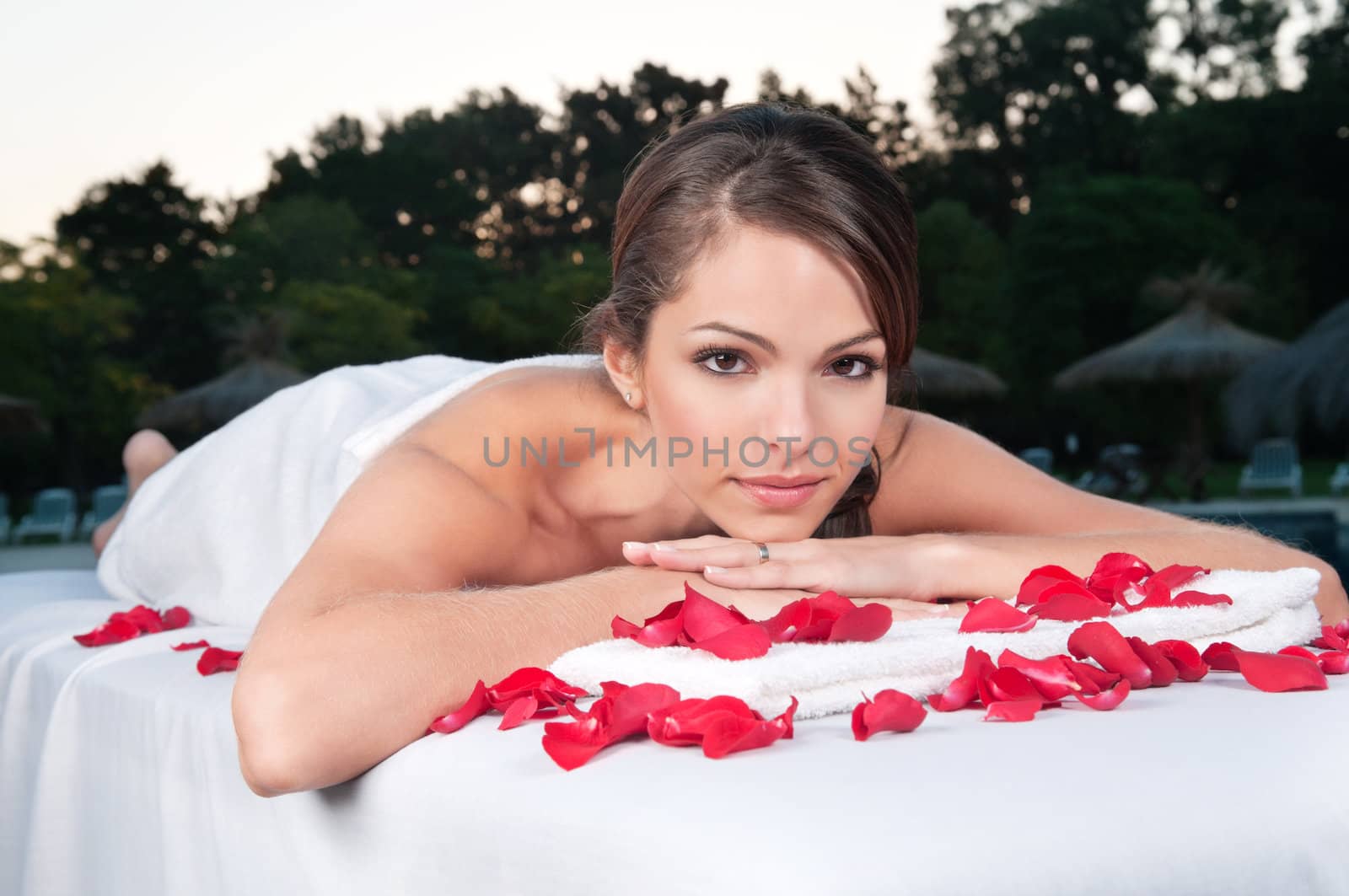 Beautiful woman at a day spa by leaf