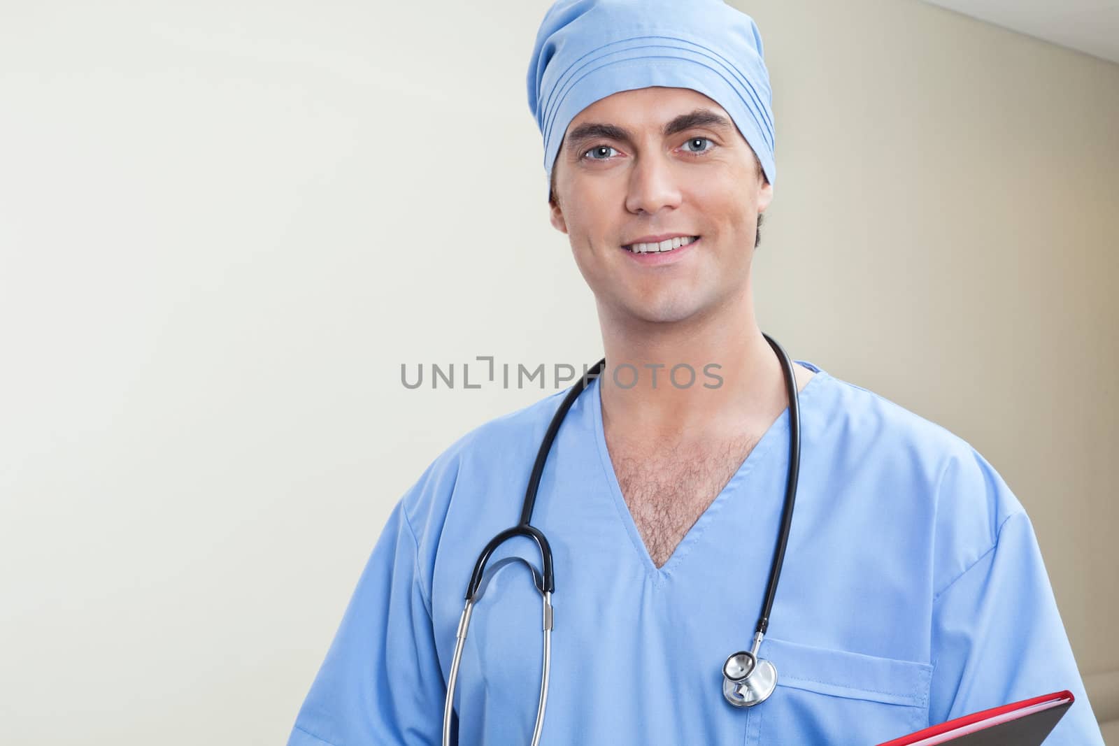 Young male doctor in hospital corridor