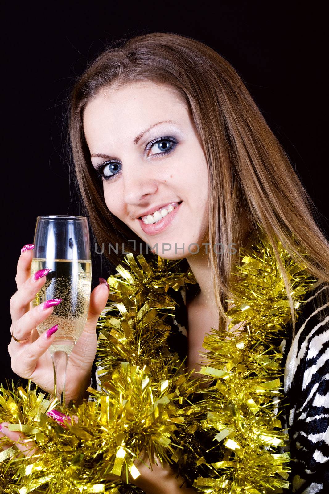 Beautiful woman enjoying a glass of pink champagne..
