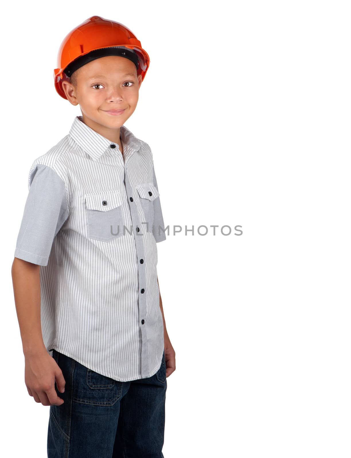A young boy dons an orange hard hat, and he smiles.