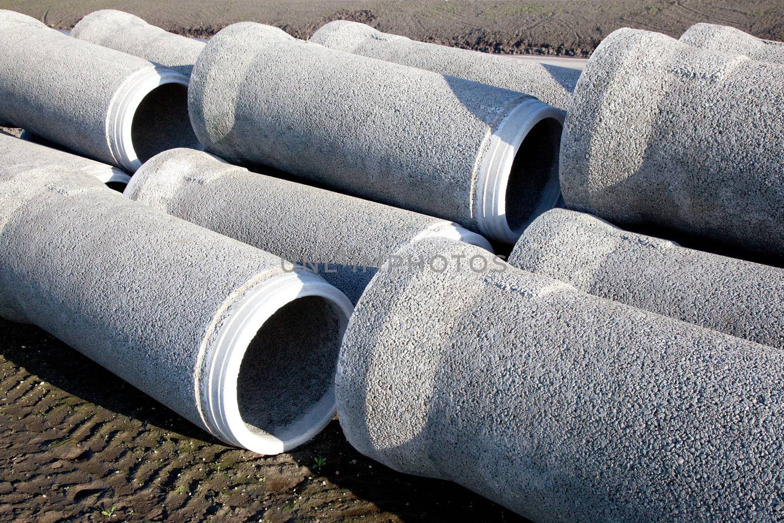 grey concrete pipes waiting by ahavelaar