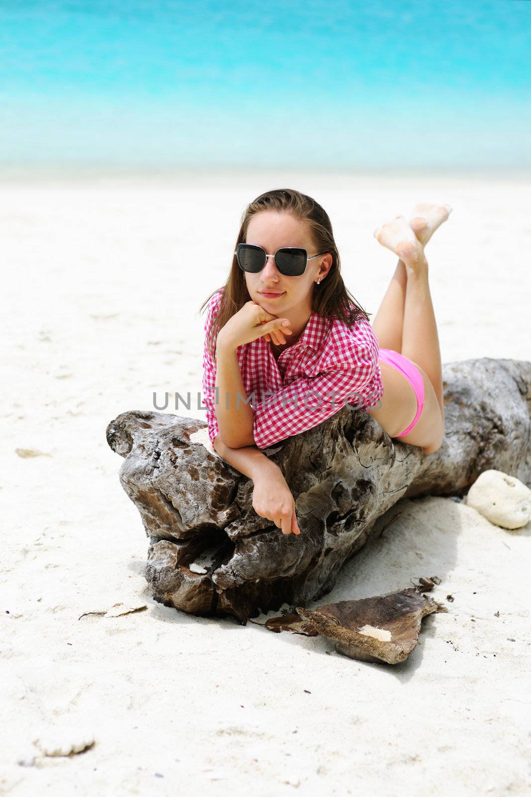 Woman in sunglasses at beach 