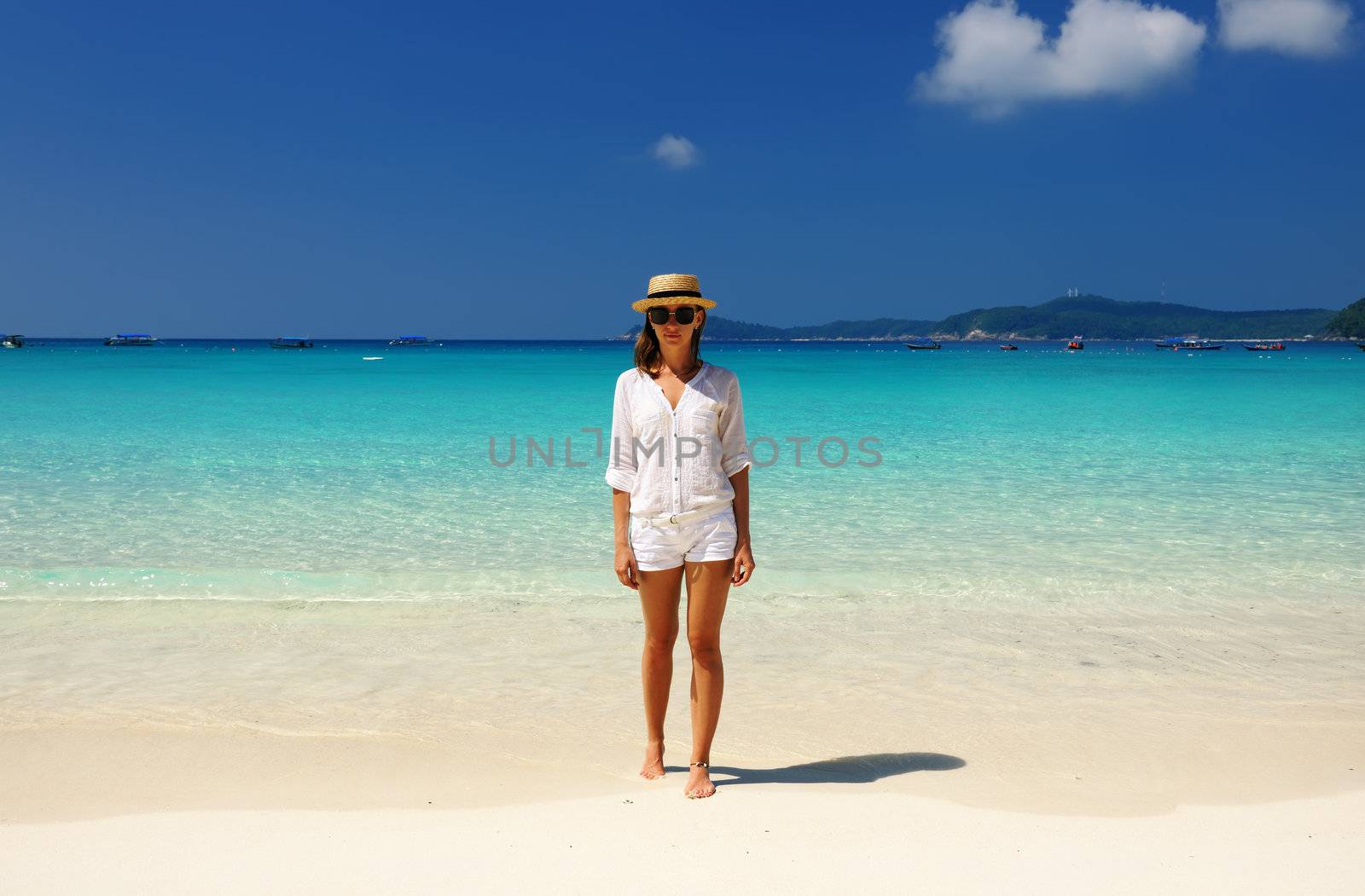 Woman in hat at beach