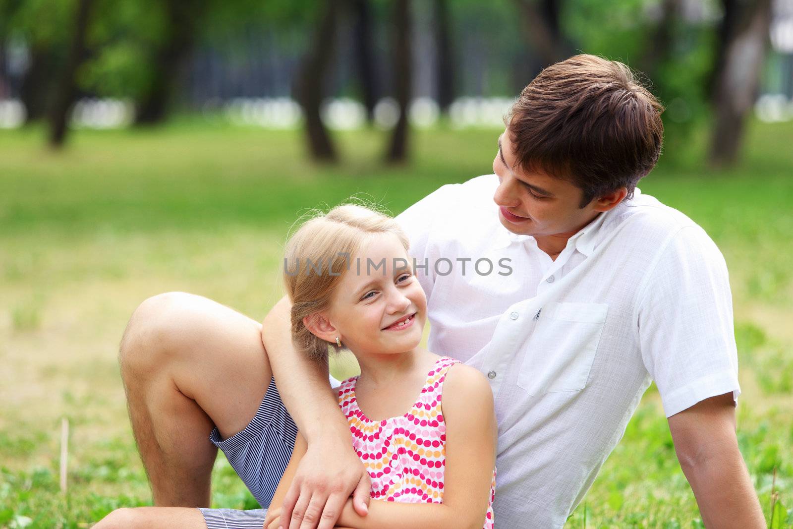 Father and daughter in the park by sergey_nivens
