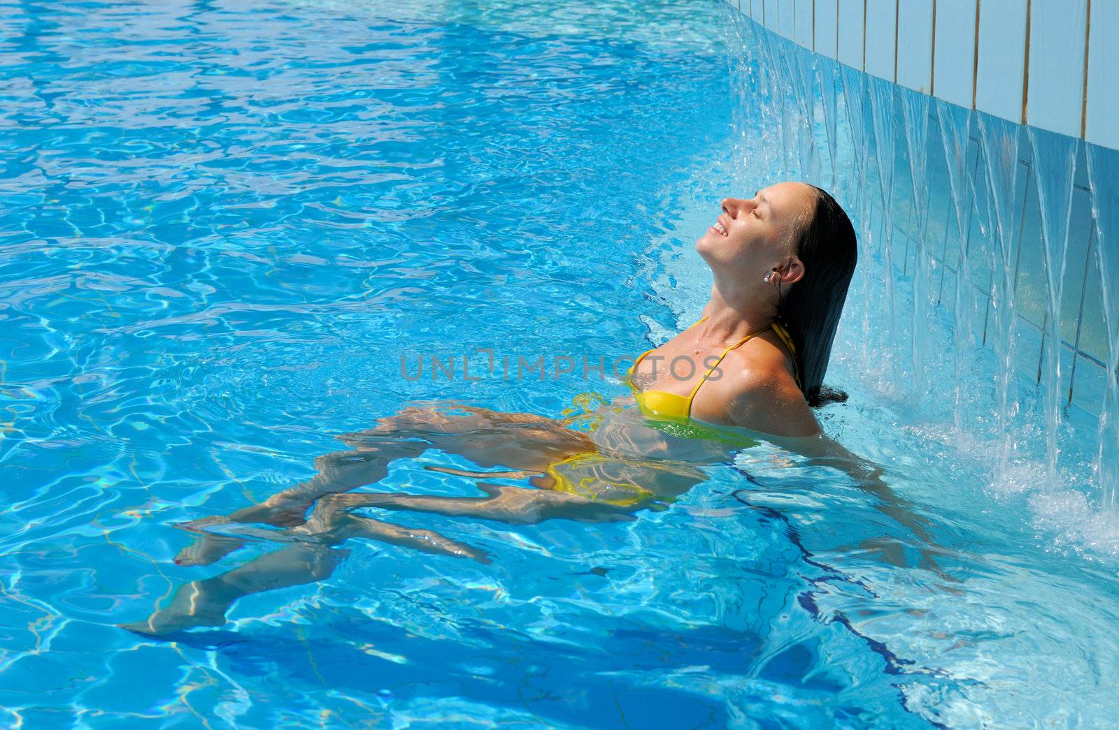 Woman relaxing at the pool 