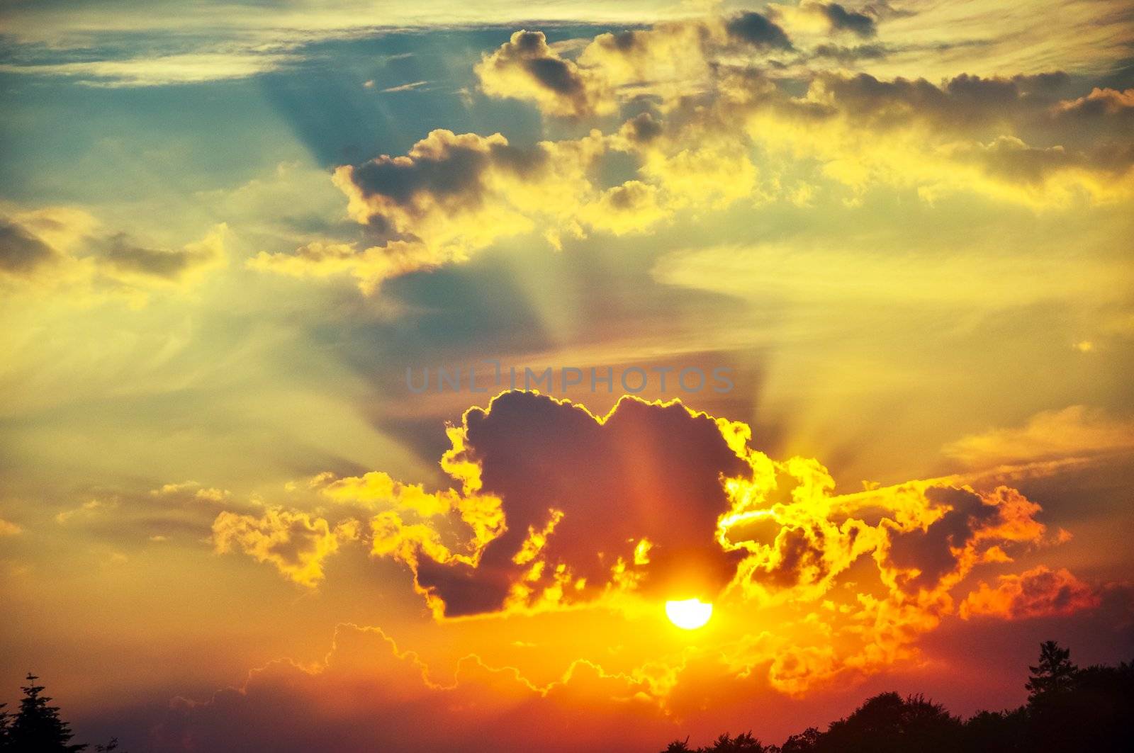 An image of Dark sky with storm clouds during sunset