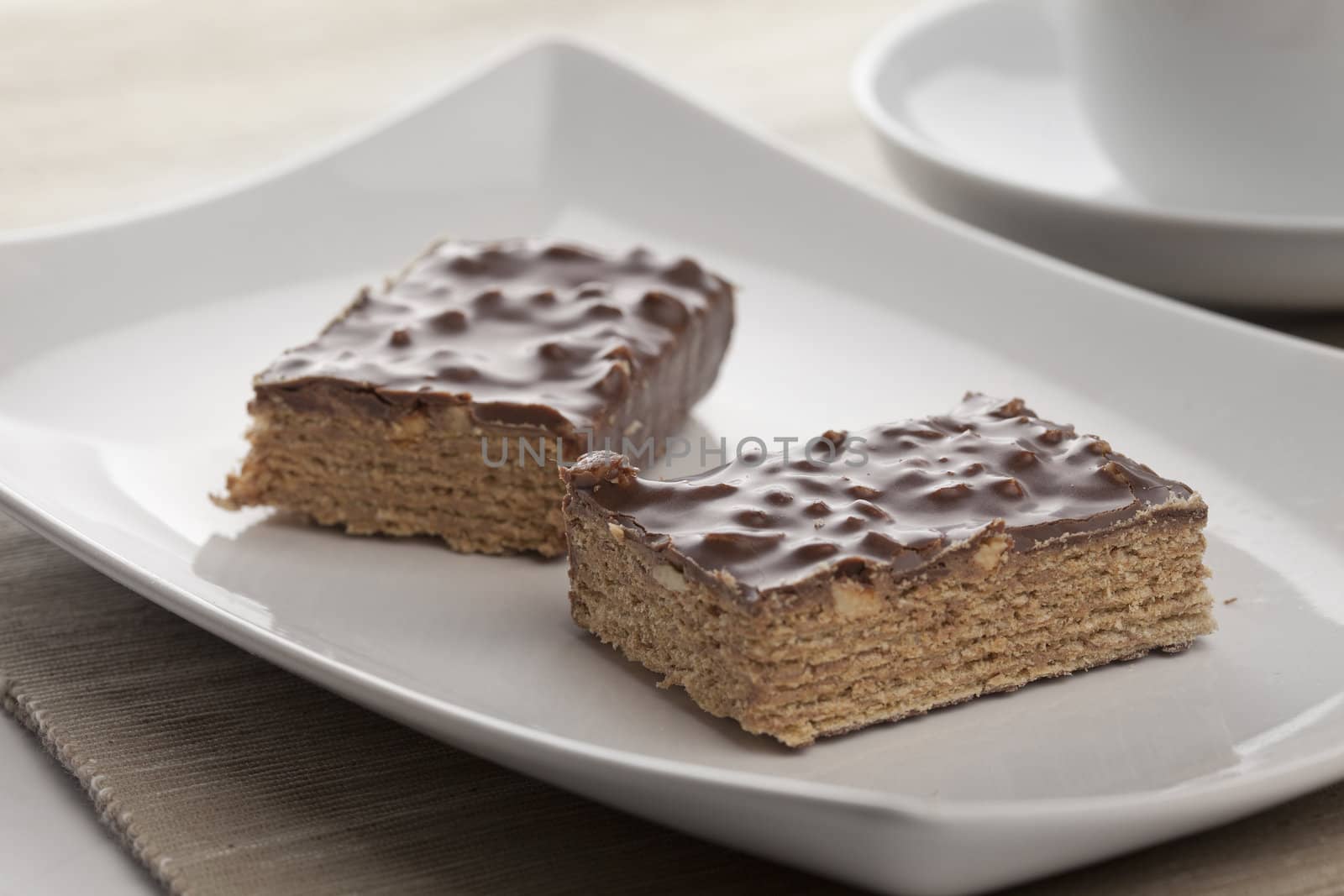 Two pieces of waffle cake on the white plate