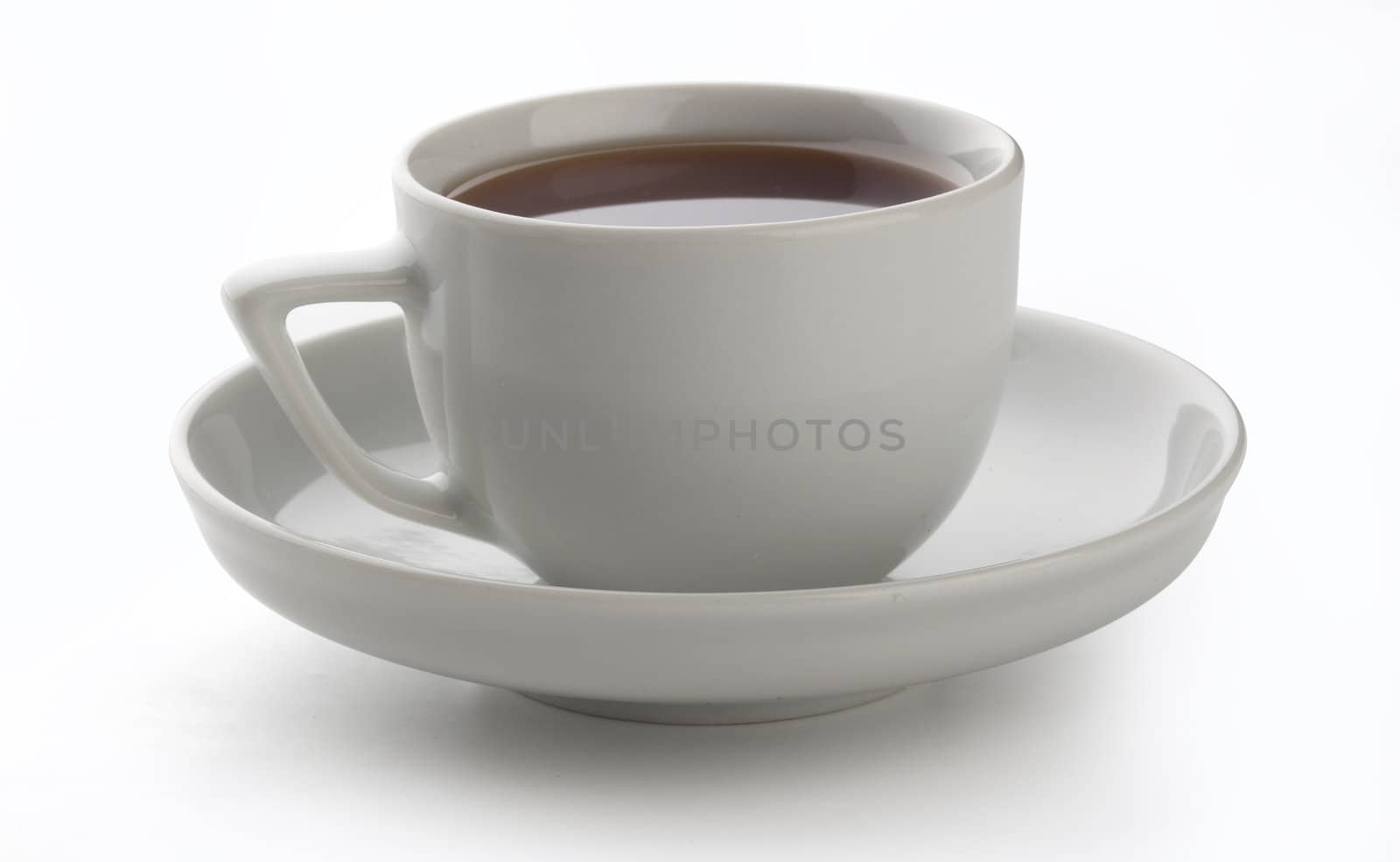 Isolated white cup of tea on the saucer