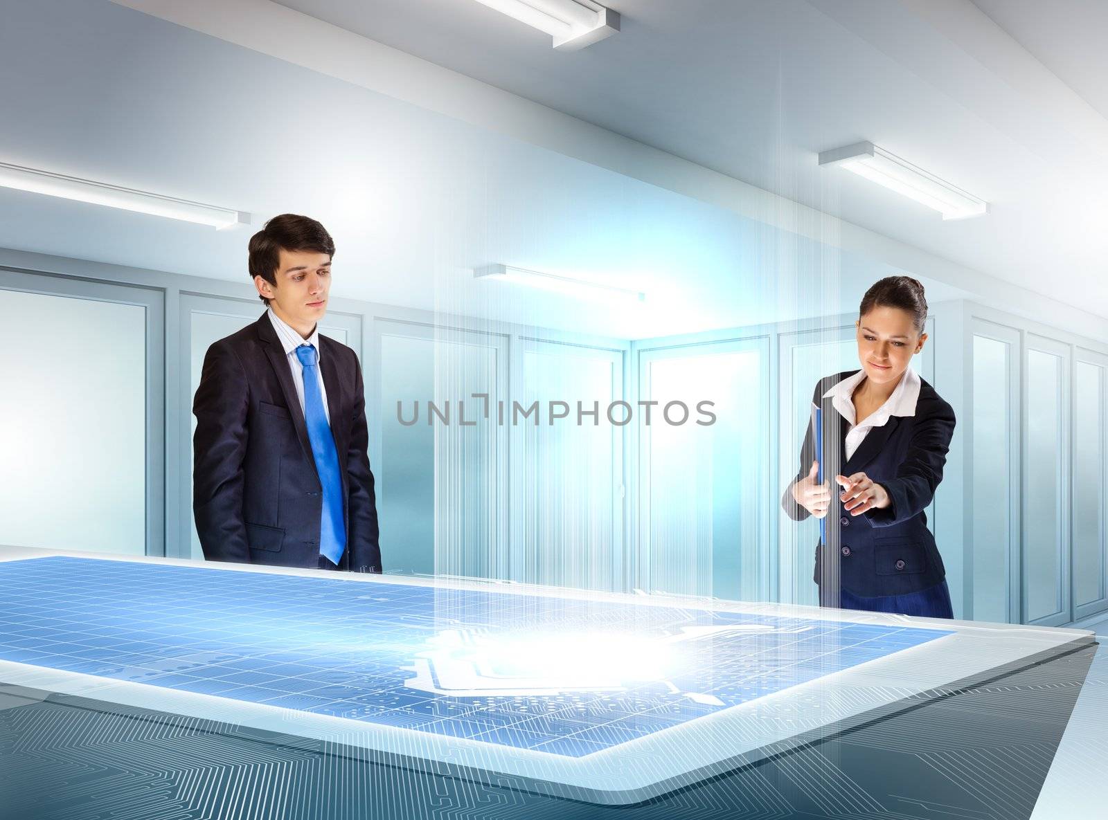 young businesspeople looking at graph of high-tech image